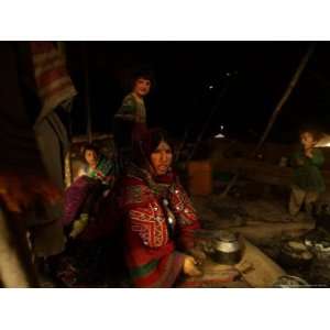 Kuchi Woman Prepares Tea Where Her Family Sets Camp on the Outskirts 