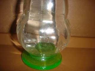 vintage green base clear glass wine decanter base glows  