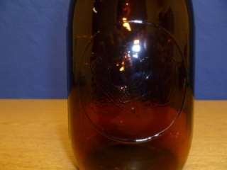 This is a beautiful Vintage Dark Amber wide mouth sprouting jar in 