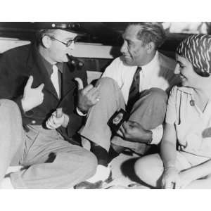  Duke Kahanamoku chats with Mr. & Mrs. John Ford on the Waikiki Beach 