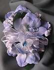 small wrist corsage blue delphenium flowers with a white butterfly