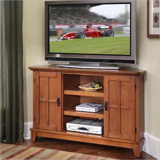 Home Styles Arts & Crafts Corner TV Stand in Cottage Oak Finish 