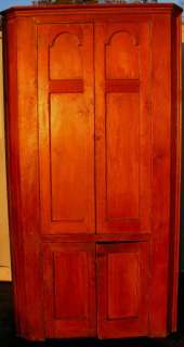   CHERRYWOOD & RED PINE CORNER CABINET WITH TOMBSTONE DOORS CIRCA 1760