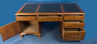  of the desk has a cabinet, a file drawer, and four regular drawers 