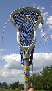  lacrosse stick. Measures 32 long. Signed STX. The lacrosse 